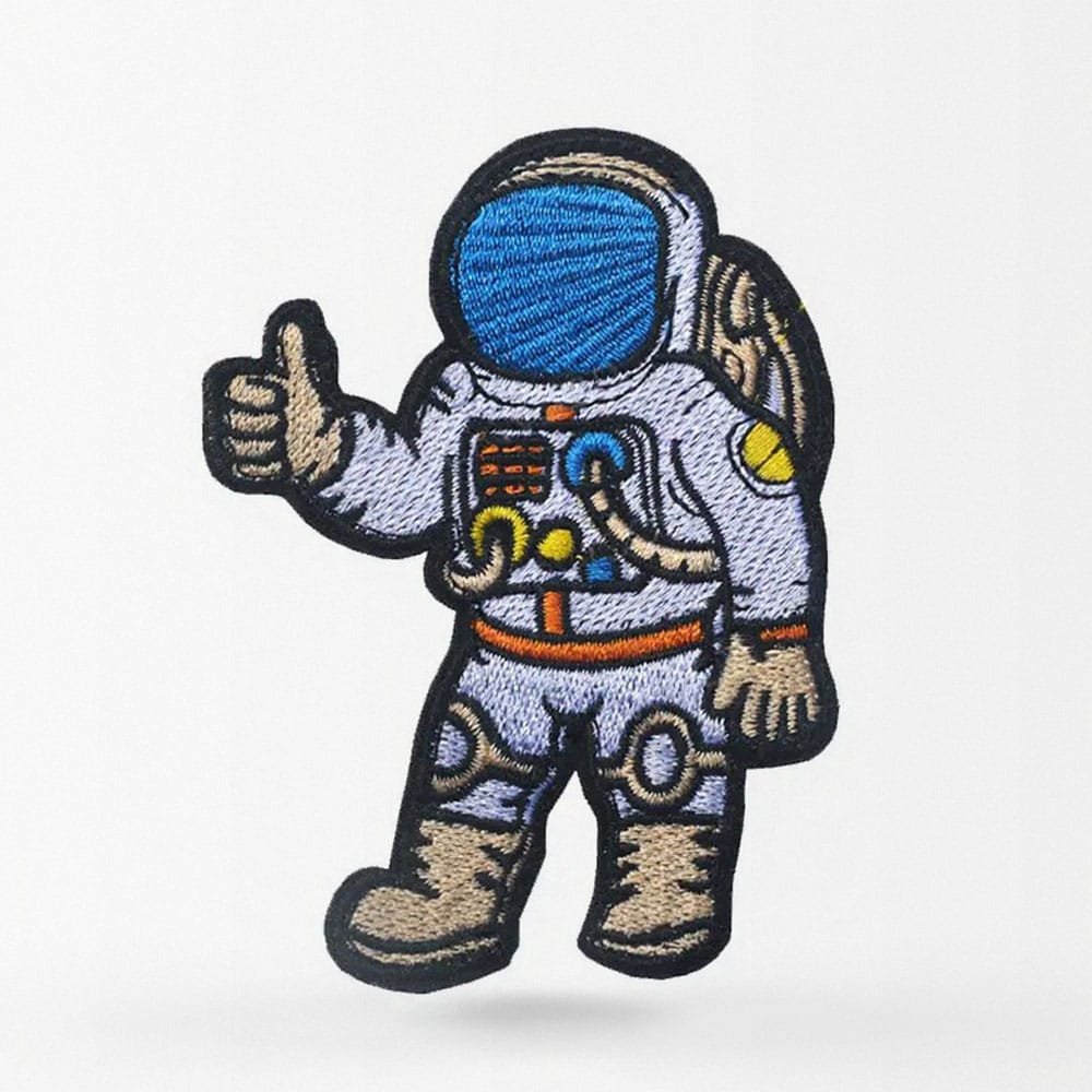 Parche de astronauta con pulgar arriba